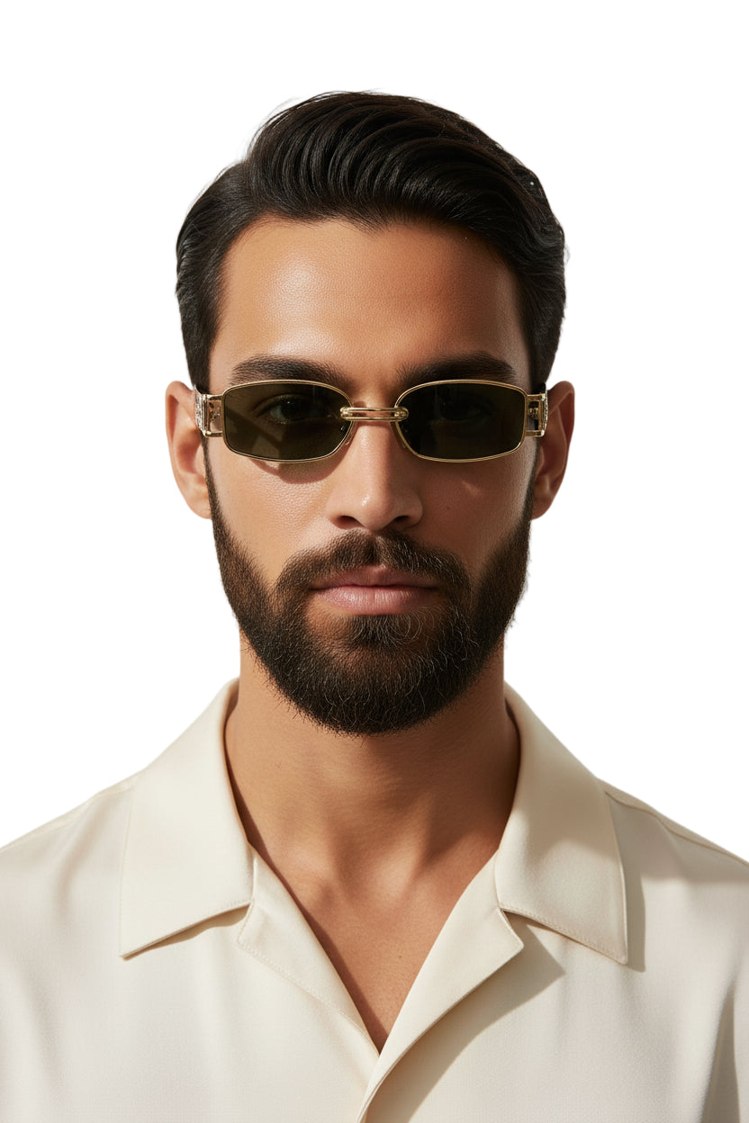 A pair of gold-colored sunglasses with a plastic and metal frame, featuring green lenses and a sleek design.