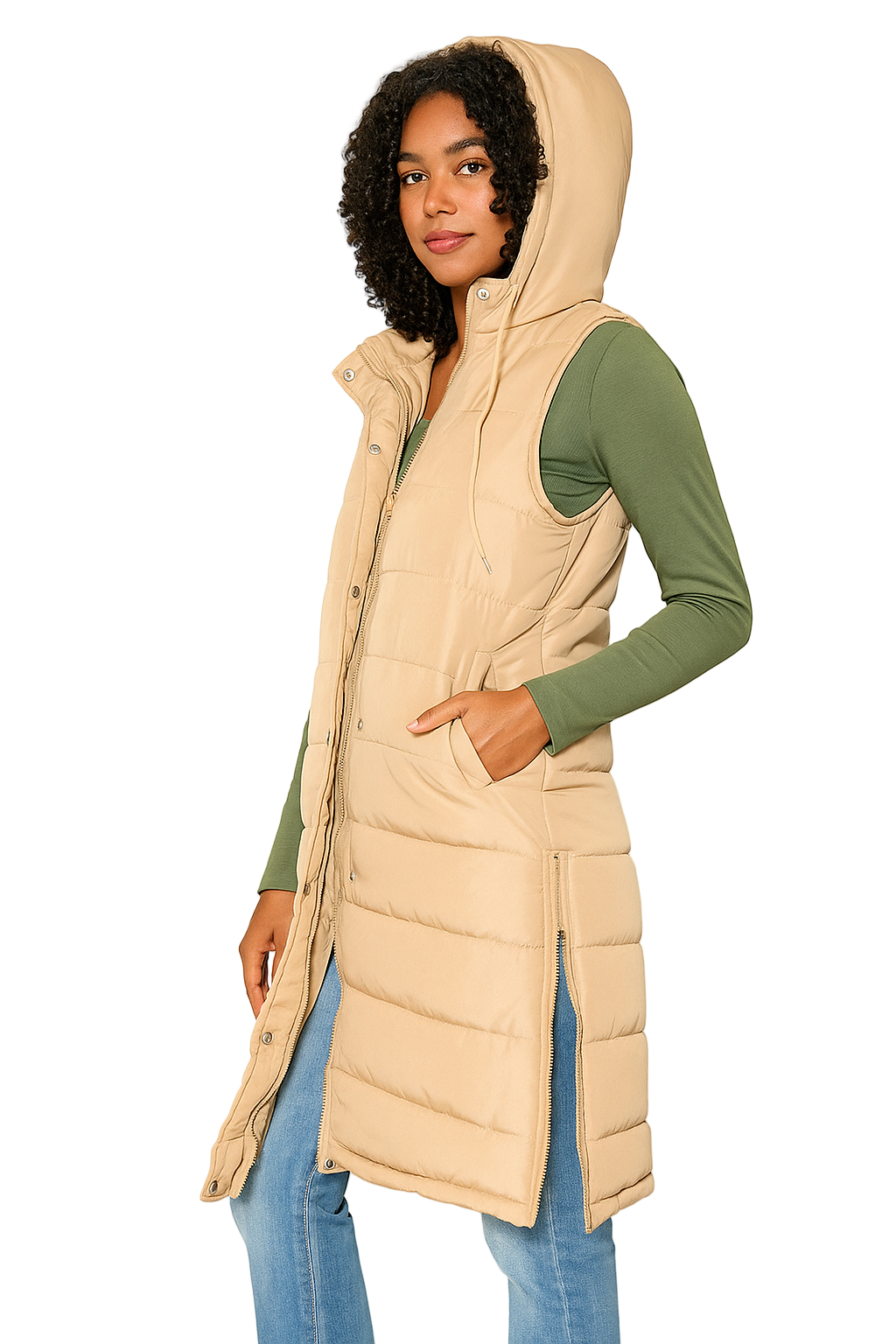 Woman wearing a beige puffer vest over a green long-sleeve shirt on a white background