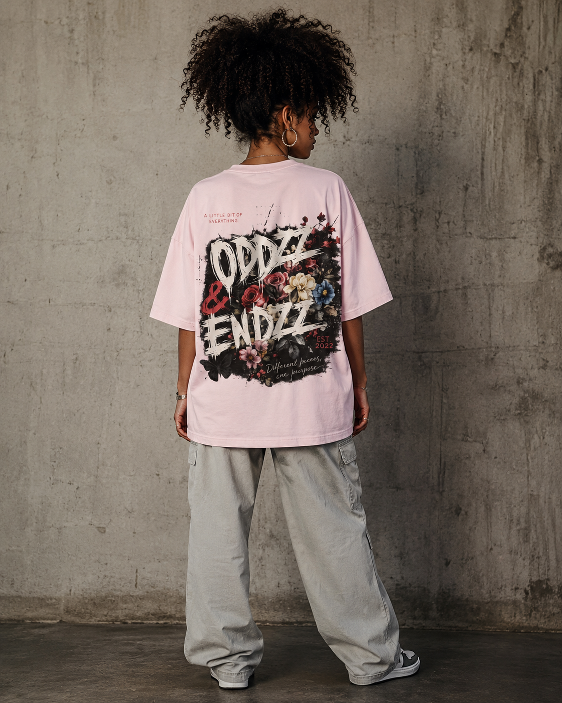 Different Pieces Oversized Tee featuring bold brush typography and vintage floral artwork by Oddzz & Endzz®
