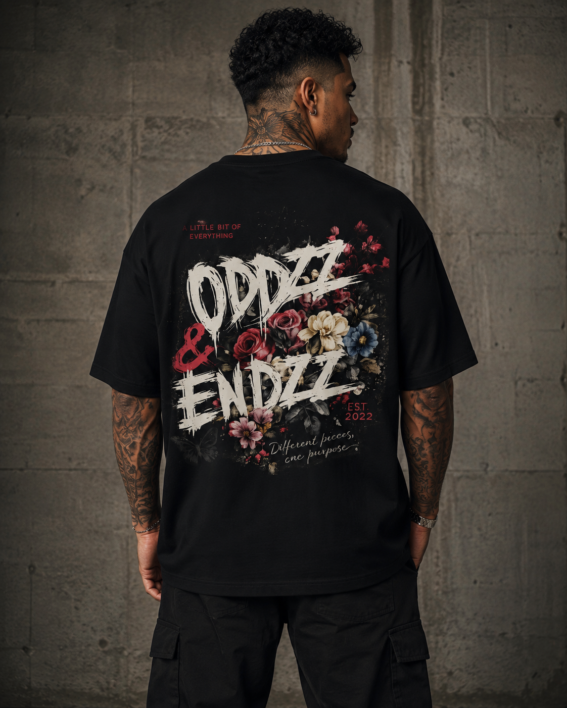 Different Pieces Oversized Tee featuring bold brush typography and vintage floral artwork by Oddzz & Endzz®