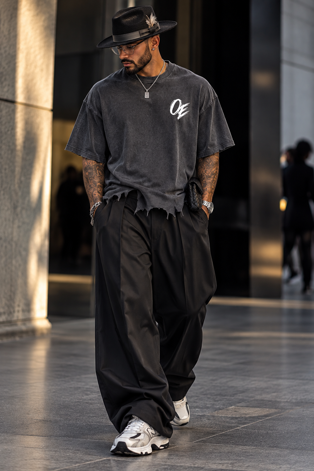 Oddzz & Endzz® washed charcoal oversized distressed tee with white OE chest logo and raw hem.
